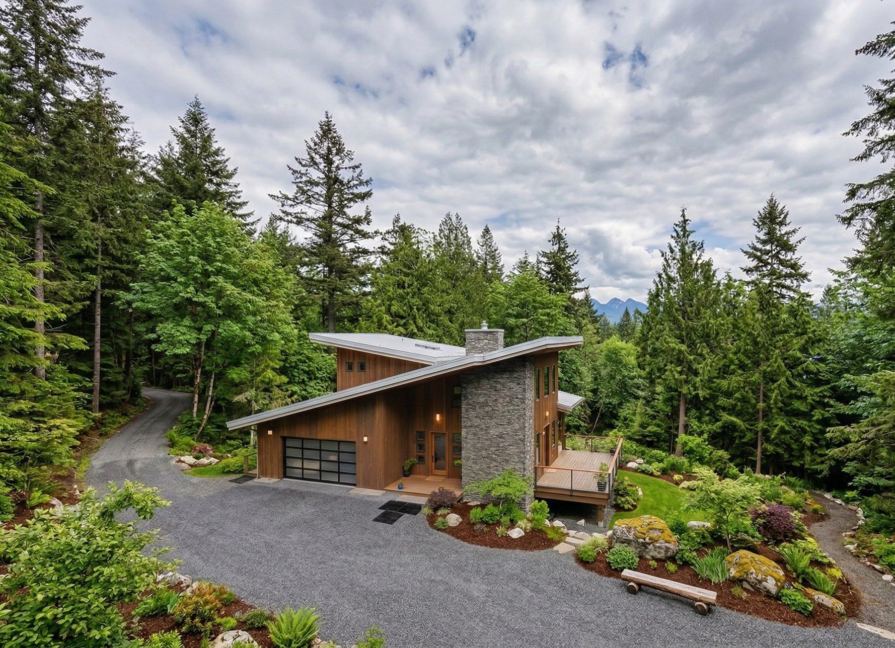 Modern house with slanted roof, wood siding, stone chimney, and glass garage door. Gravel driveway, trees.