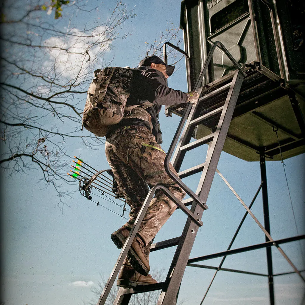 Image of a bow hunter climbing the ladder of a hunting blind