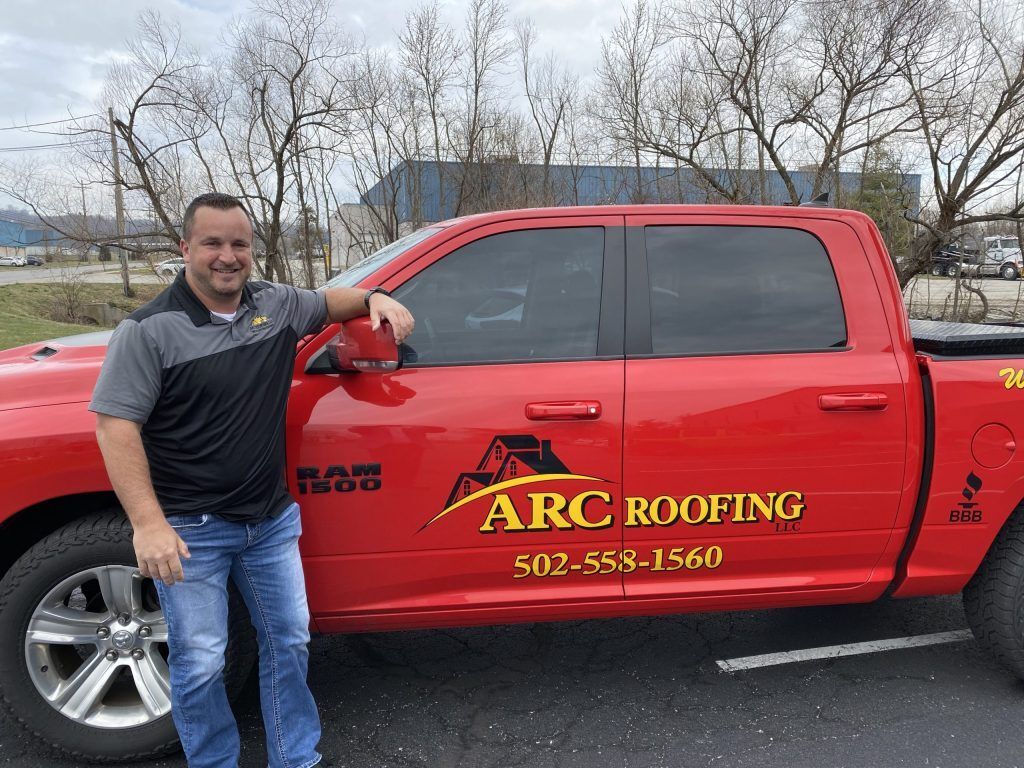 Man with red truck — Georgetown, IN — ARC Roofing LLC
