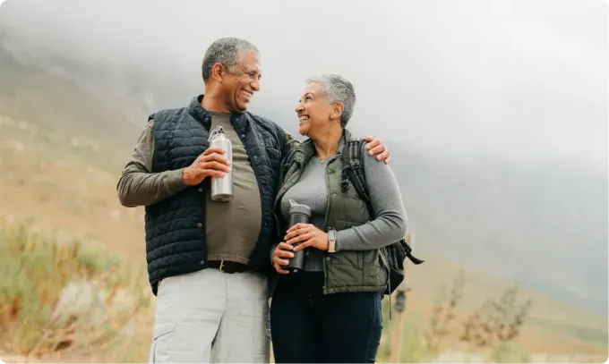 An older couple hiking together