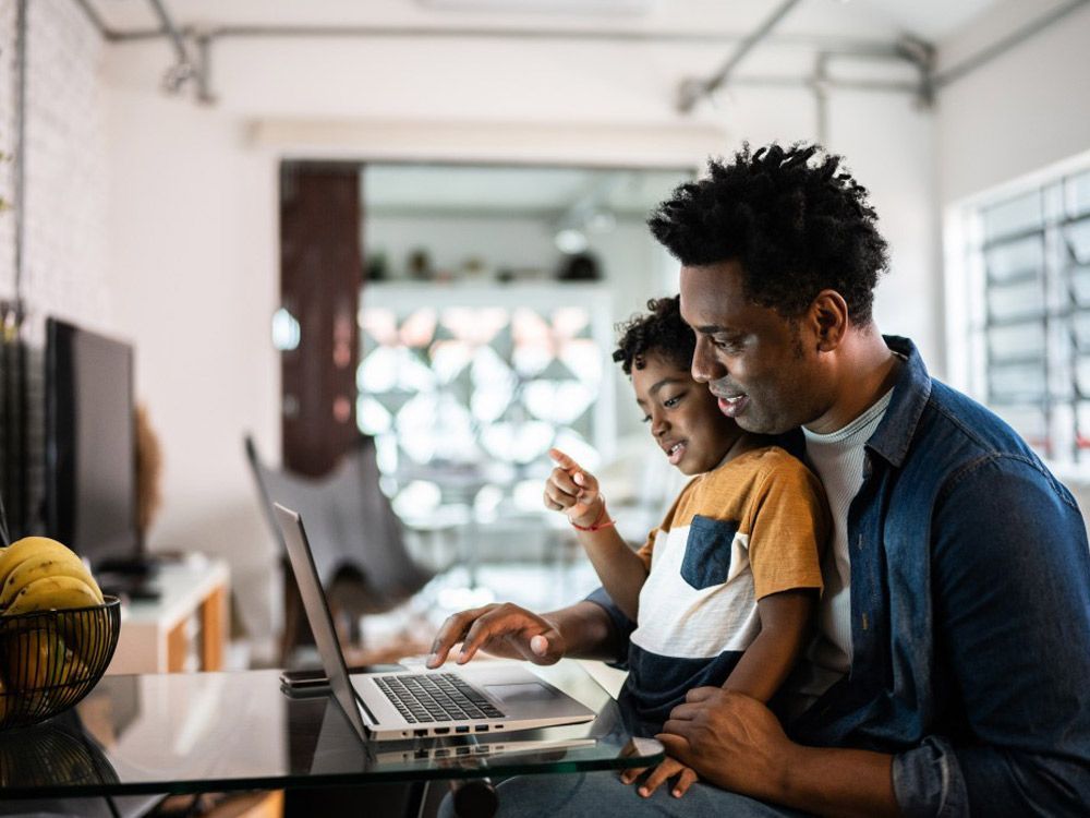 people shaking hands wearing construction hard hats smiling