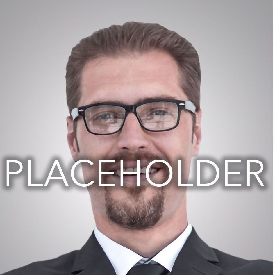 A man wearing glasses and a suit has the word placeholder above his head