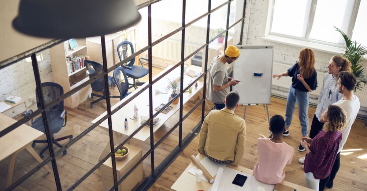Team collaborating in a modern office, discussing ERP security risks and strategies.