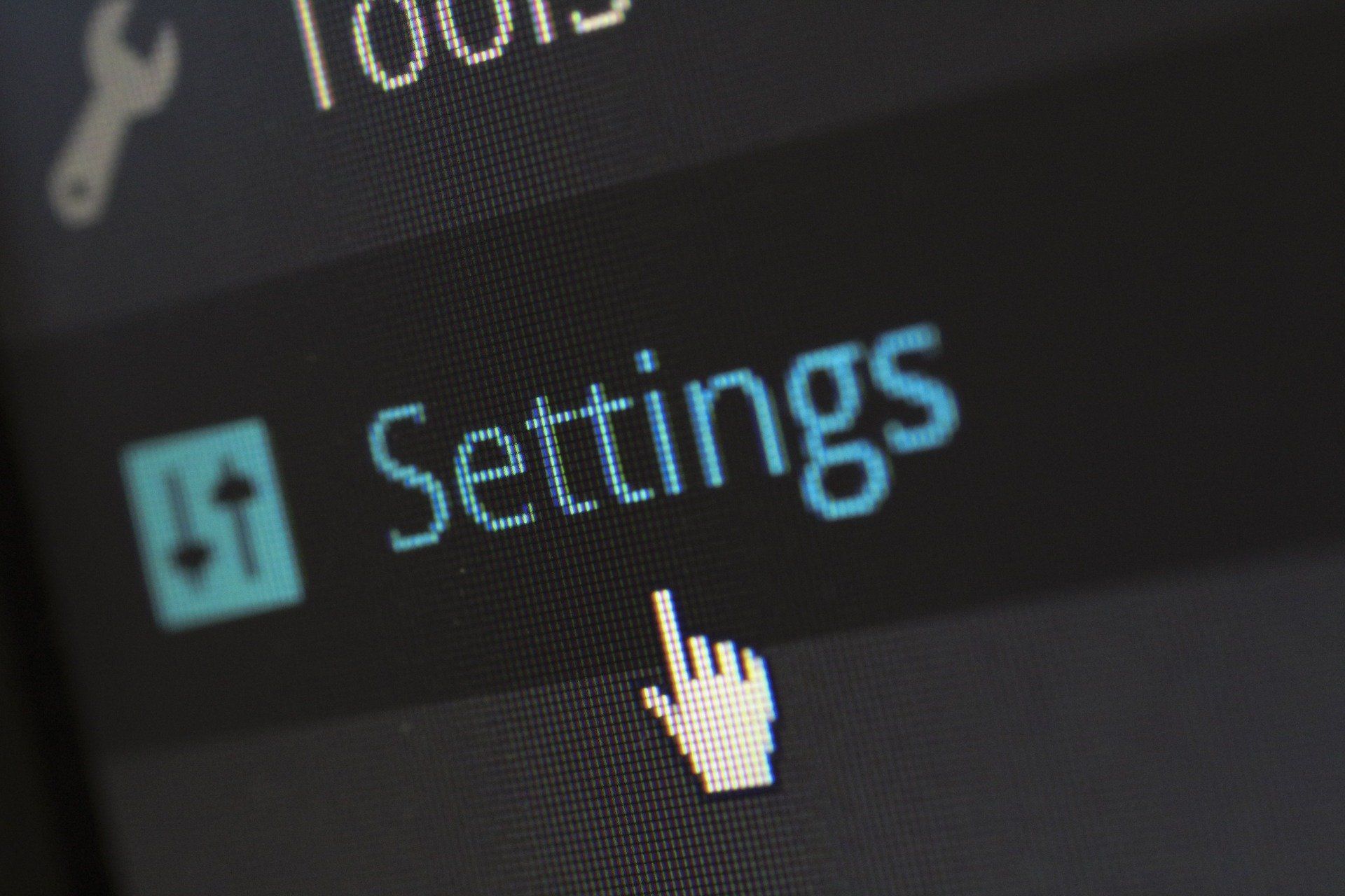A close up of a computer screen that says settings