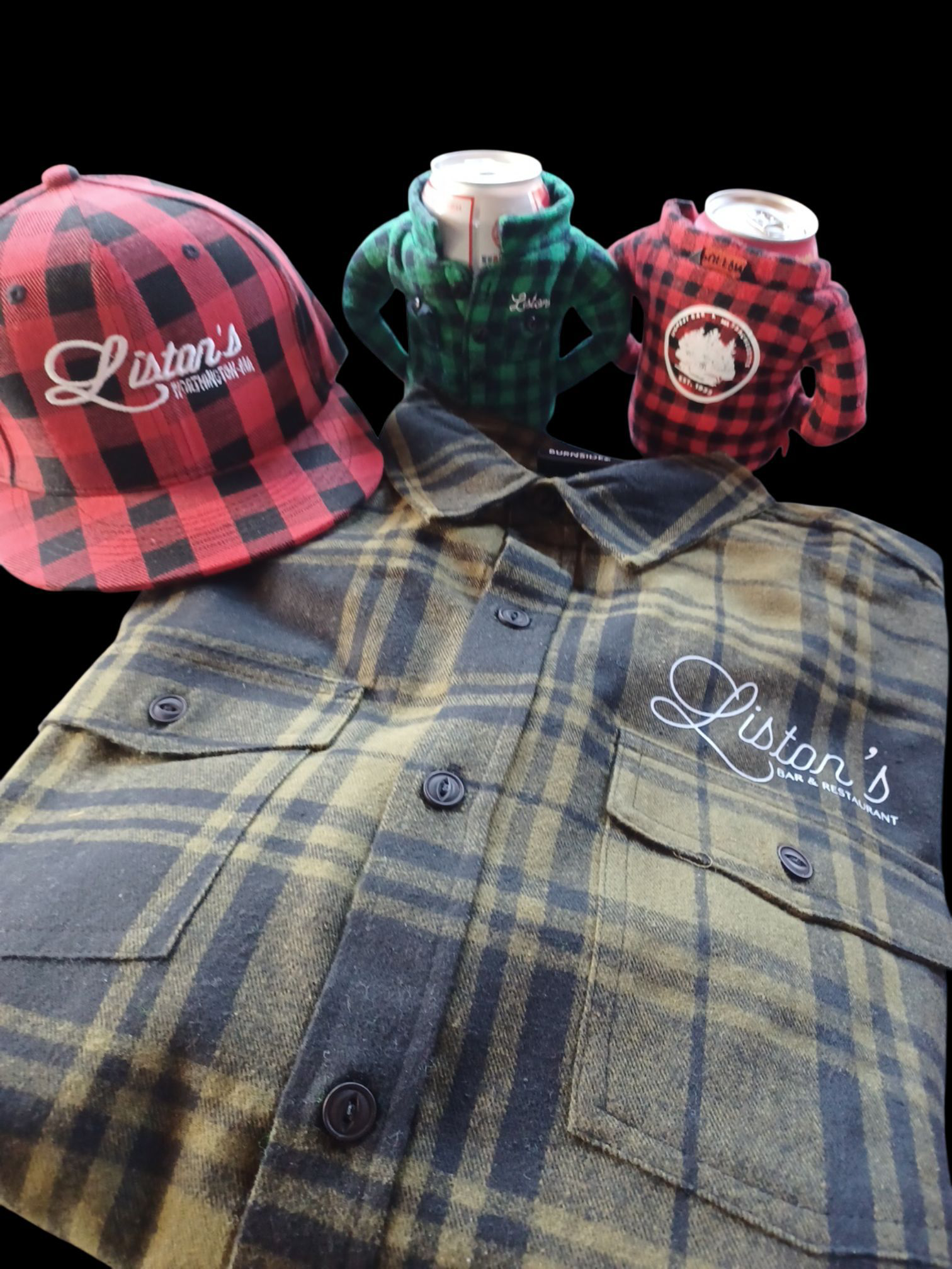 A plaid hat, two flannel-covered drink insulators, and a green plaid button-up shirt, all featuring 