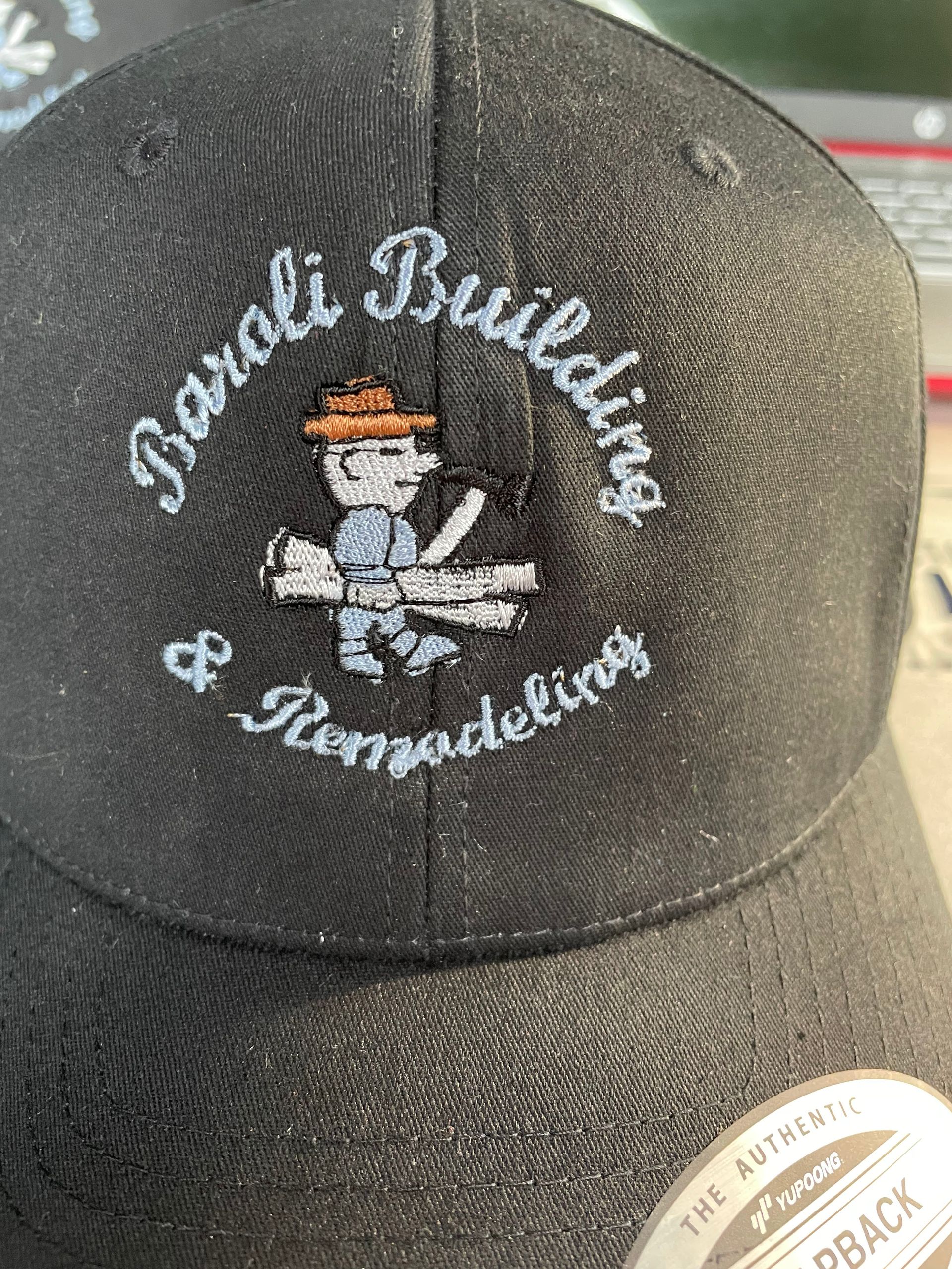 A black baseball cap featuring an embroidered logo for 