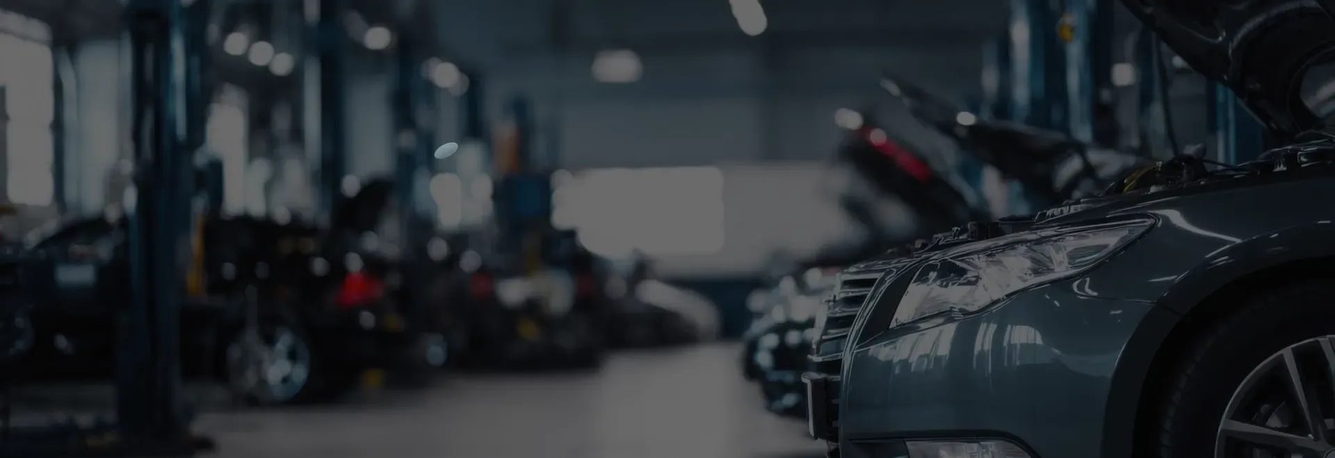 Various cars parked in garage | Auto Brakes & Lube