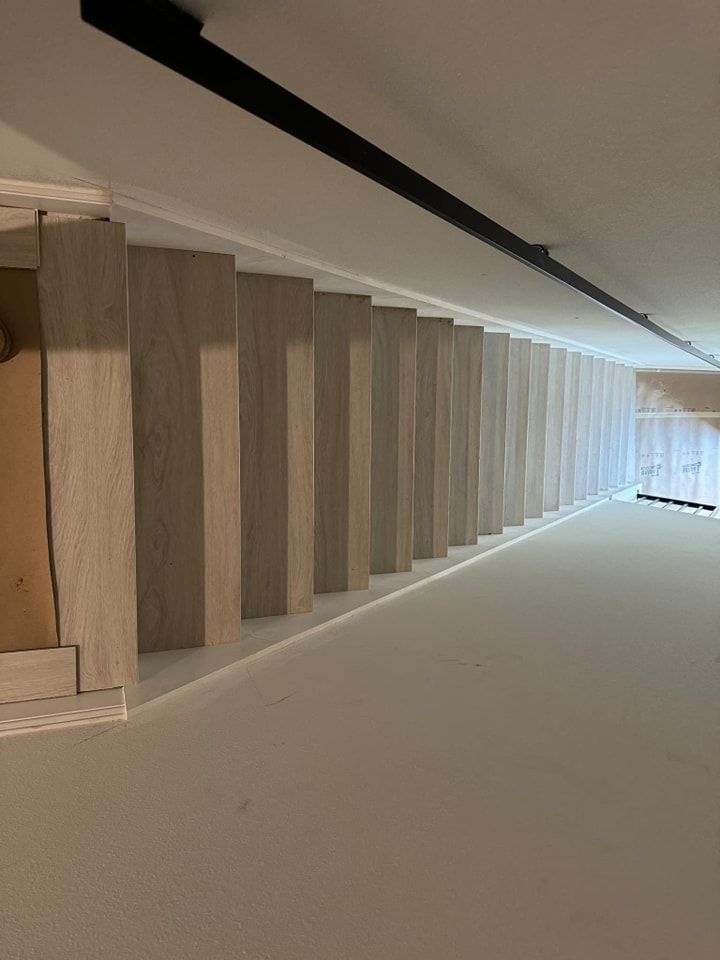 A row of stairs leading up to the second floor of a building.