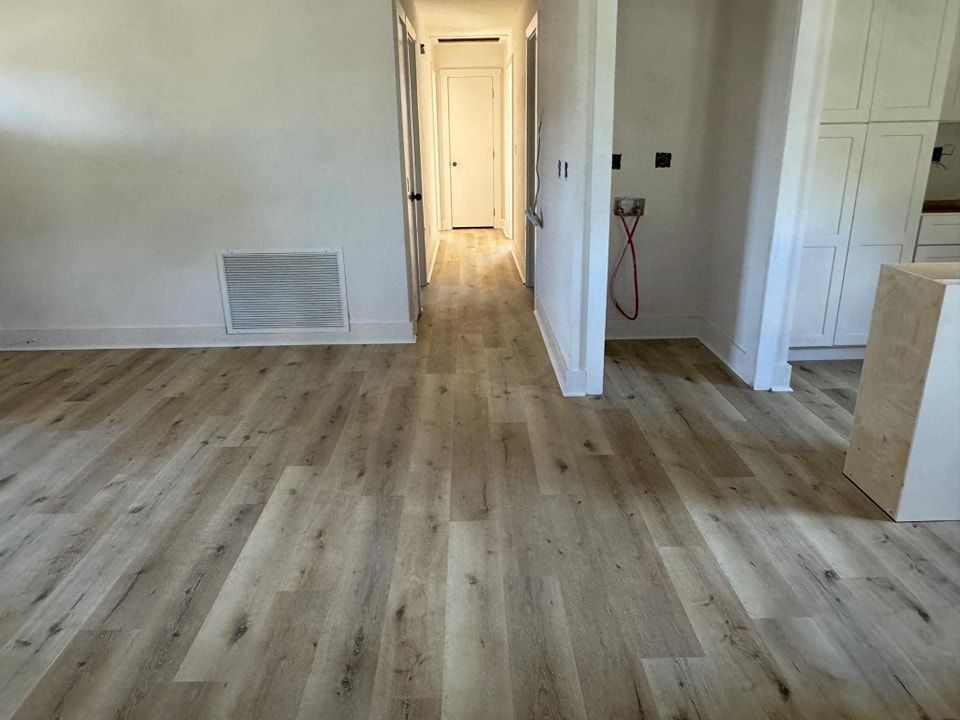 A hallway in a house with hardwood floors
