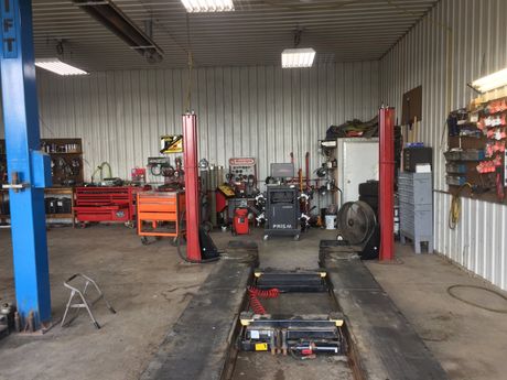 the inside of a garage with a lot of tools and equipment .