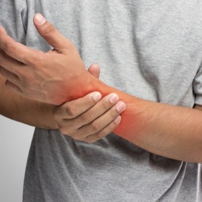 person with pain in their Elbow, Hand and Wrist