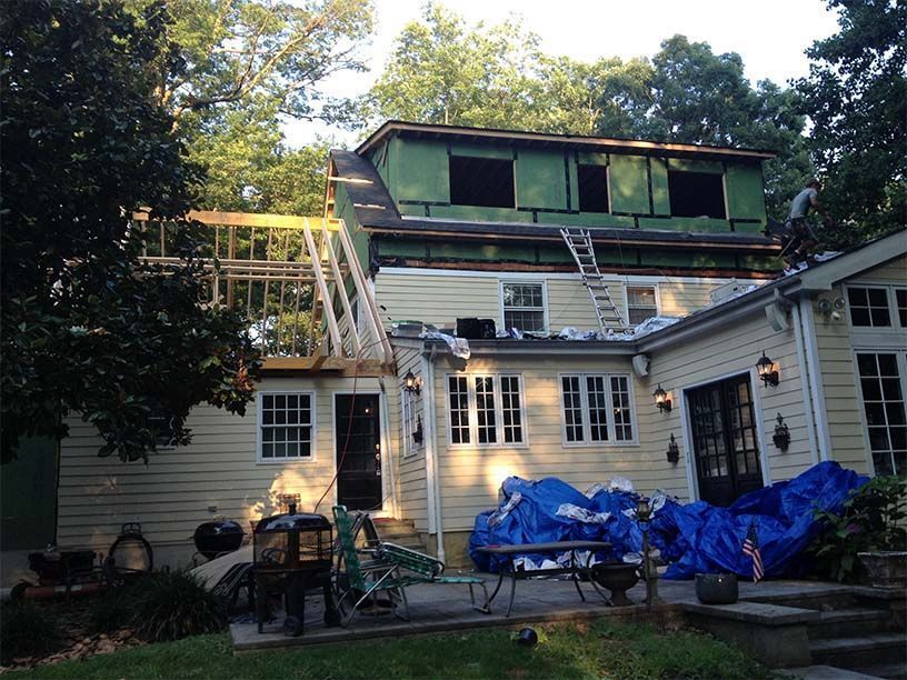 A house with a roof that is being remodeled