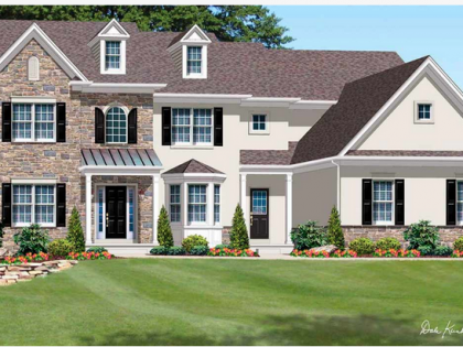 A large white house with a brown roof and black shutters