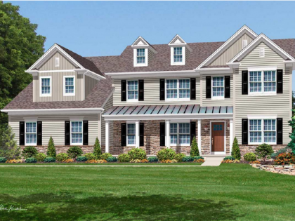 A large house with a lot of windows and shutters