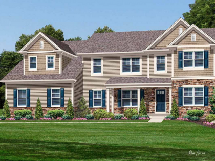 A large house with a lot of windows and blue shutters