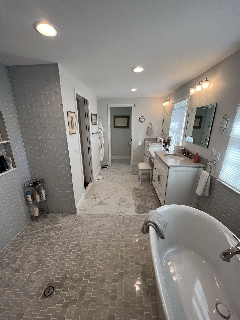 There is a bathtub in the middle of the bathroom.