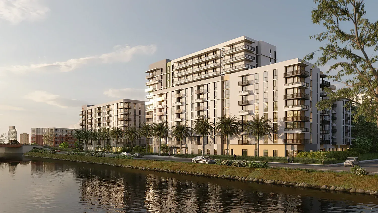 Exterior rendering of a modern, multi-building apartment complex along a waterfront with palm trees.