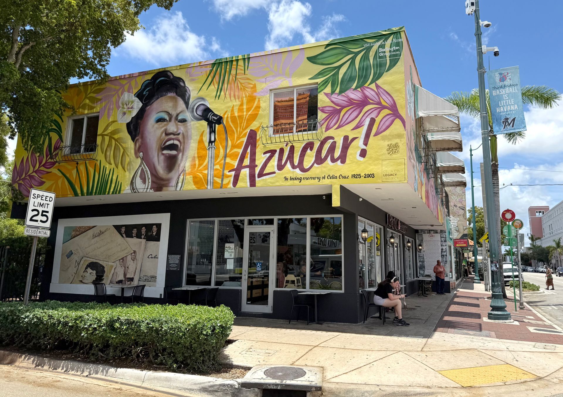 A vibrant mural of Celia Cruz on a building corner in Miami.