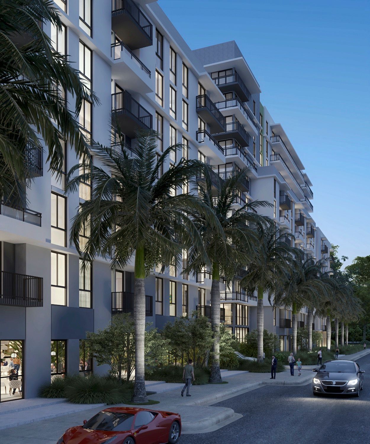 Multi-story apartment building with palm trees and cars on street.