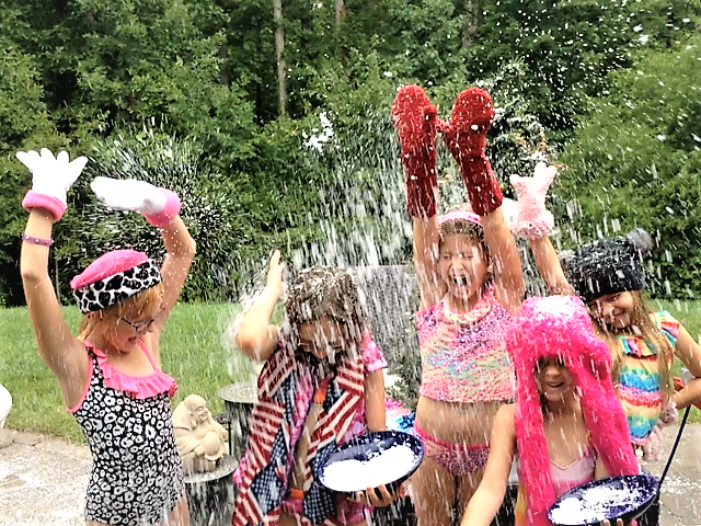 children throwing snow in the air