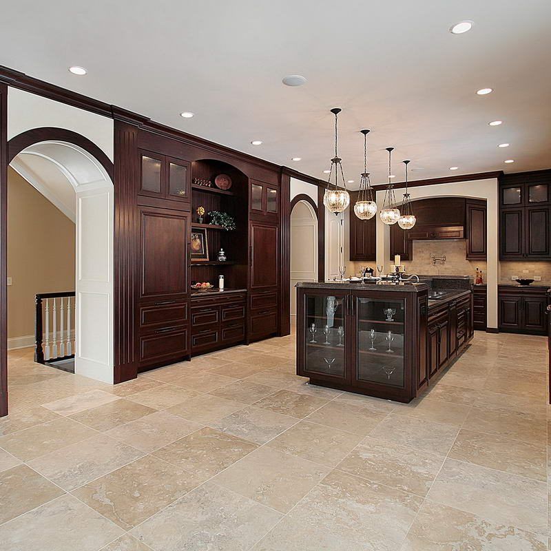 A kitchen with a large island and lots of cabinets