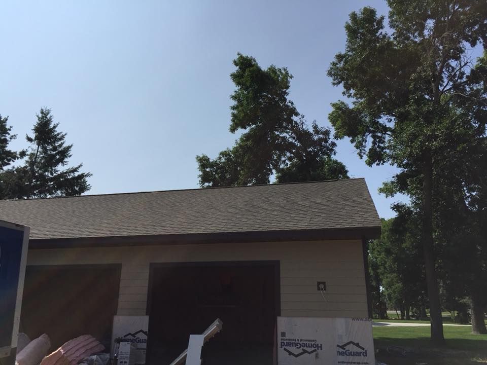 A garage with a roof that is being installed