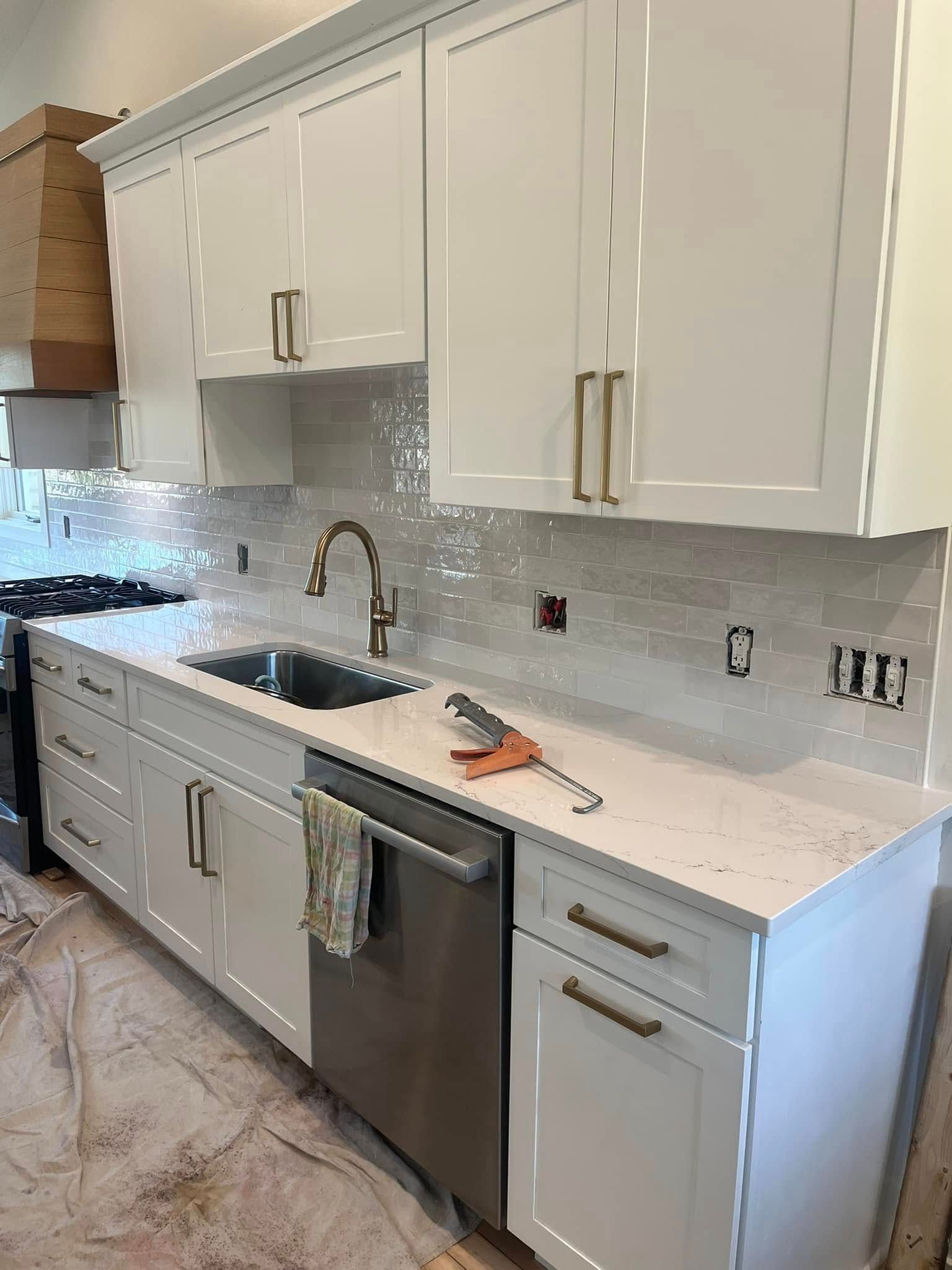 A large gray house with a black roof