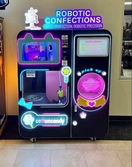 Robotic cotton candy machine dispensing fresh cotton candy at military base
