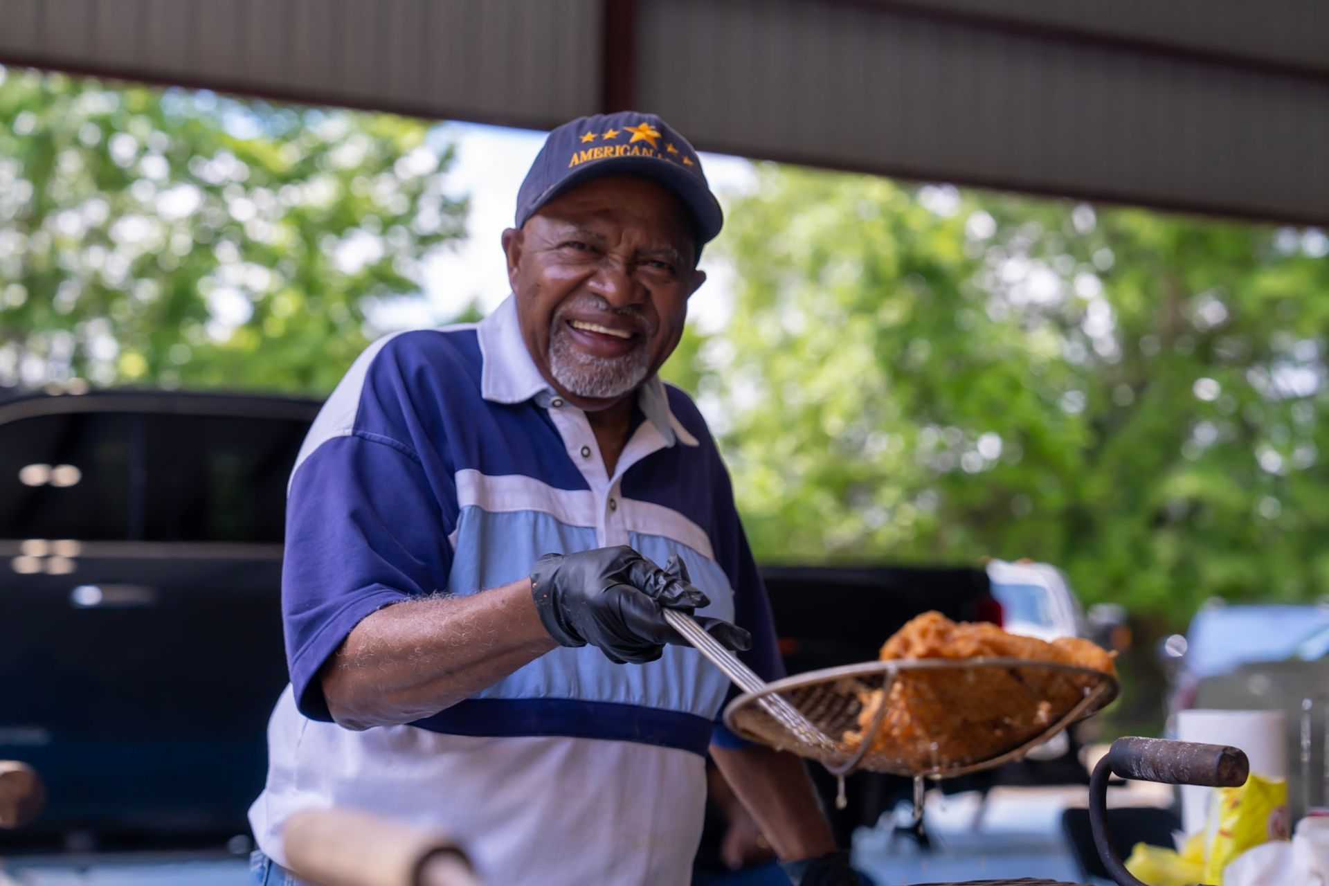 A delicious plate of golden fried fish and hushpuppies at a community event.