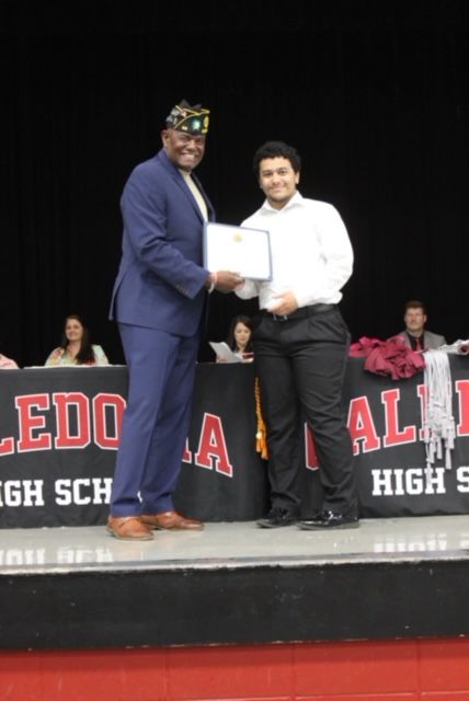 Robert Bishop presenting scholarship