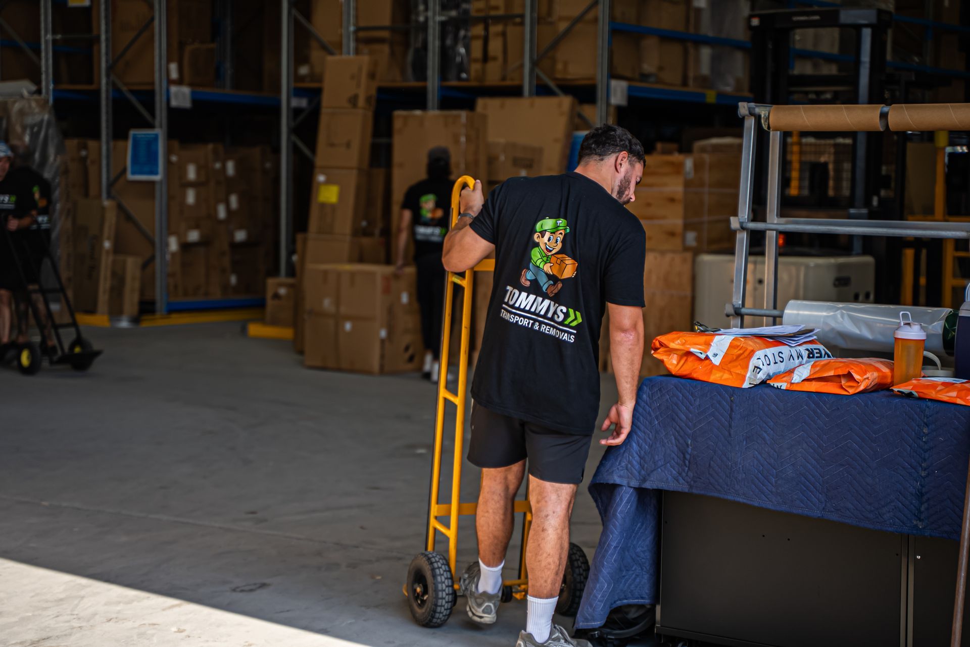 Tommy's Transport and Removals staff member is moving warehouse