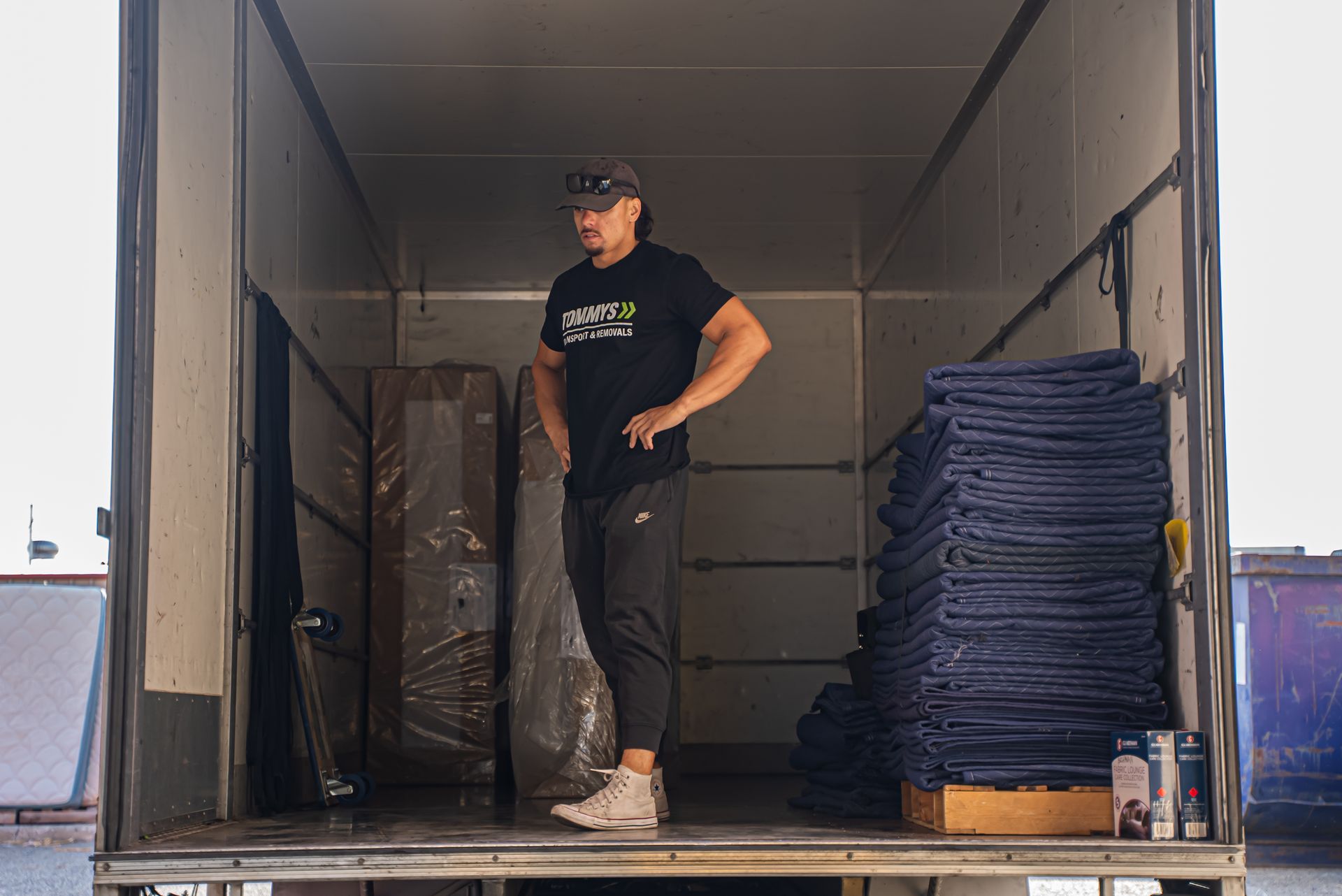 Removalist  inside a moving truck with blankets ready for house removals in perth.
