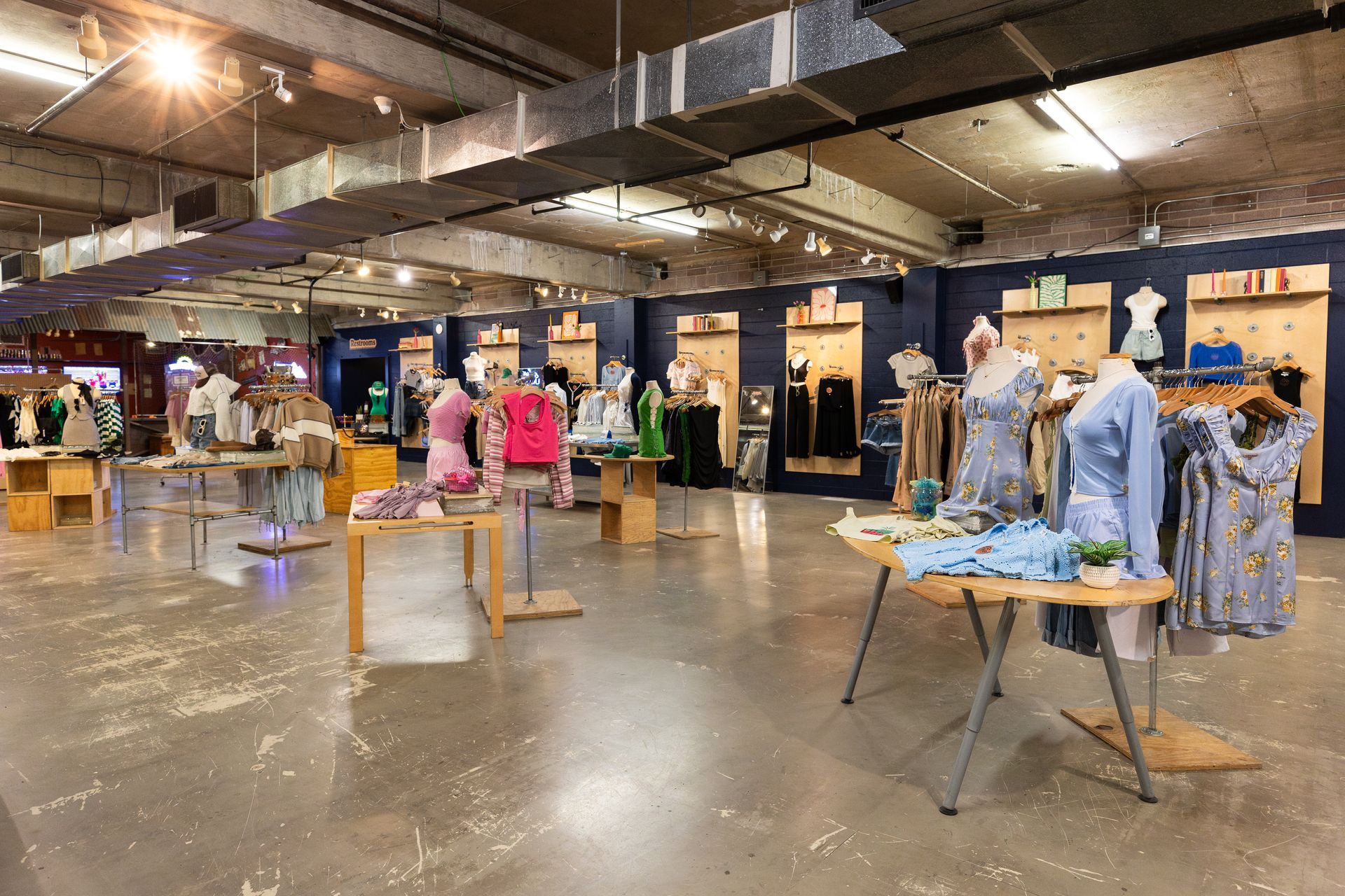 A large store filled with lots of clothes and mannequins.