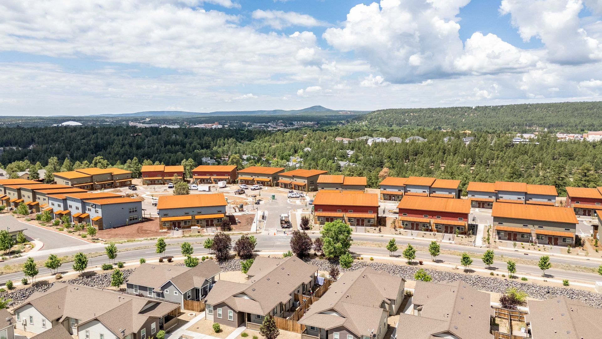 An aerial view of a residential area with lots of houses and trees.