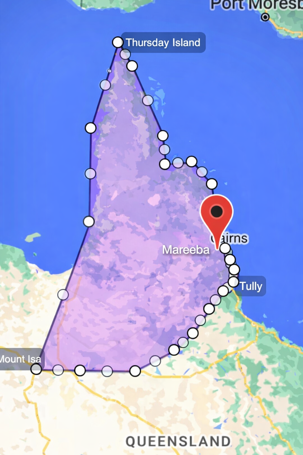 Map showing a purple-shaded area of Queensland, Australia, outlined with white dots. A red marker pinpoints Cairns.