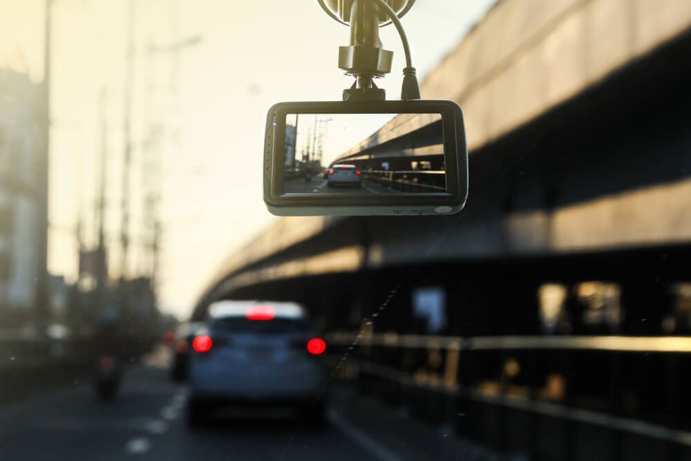 A Rear View Mirror with A Dash Cam Attached to It — ADAS Calibration Pty Ltd in Rockdale, NSW