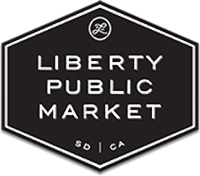 a black and white logo for liberty public market.