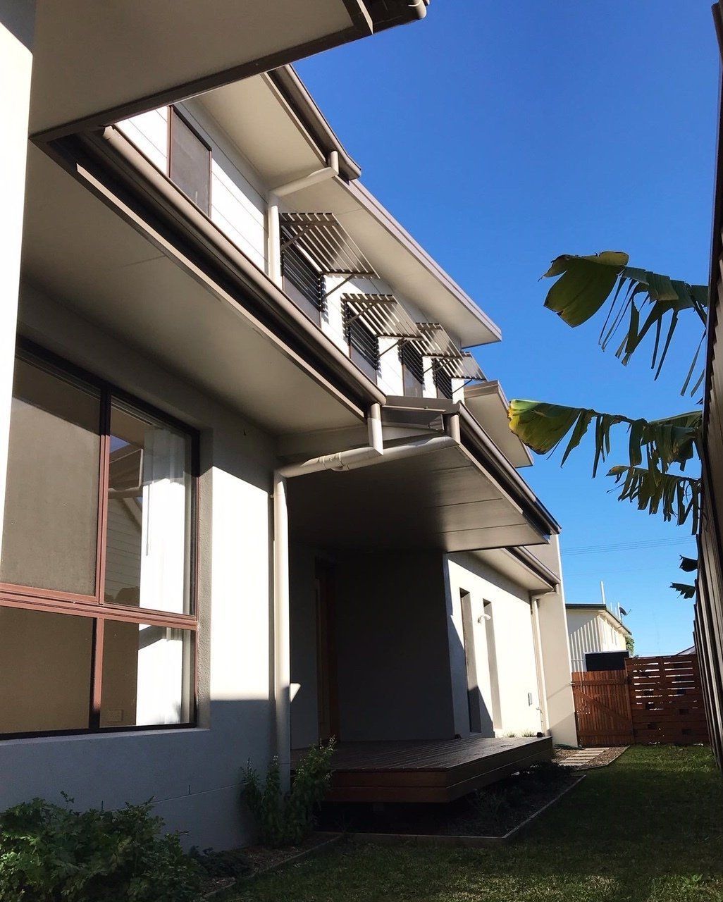A house with a blue sky in the background