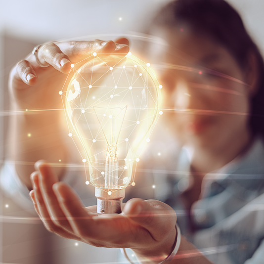 Image of a woman holding a lightbulb