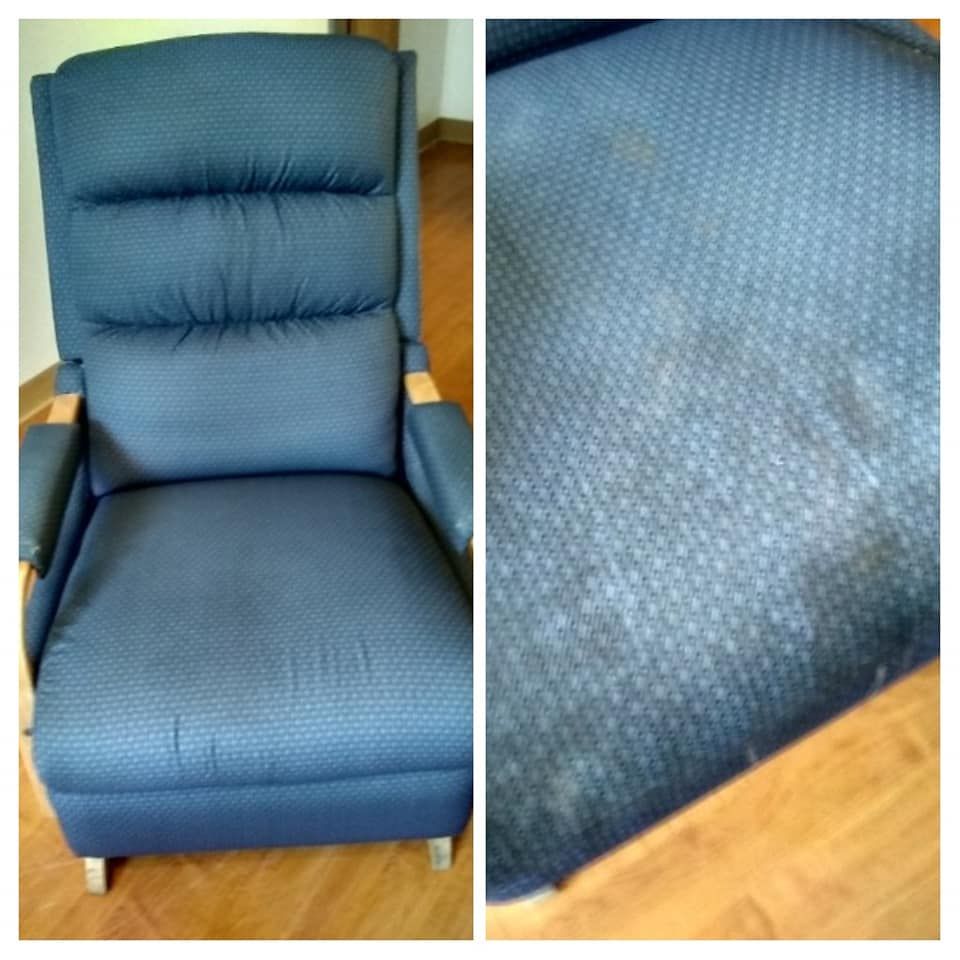 a blue chair sits on a wooden floor