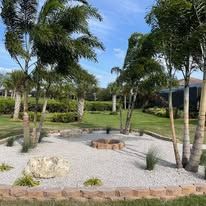 There is a fire pit in the middle of the garden.