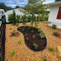 There is a tree in the middle of the garden.