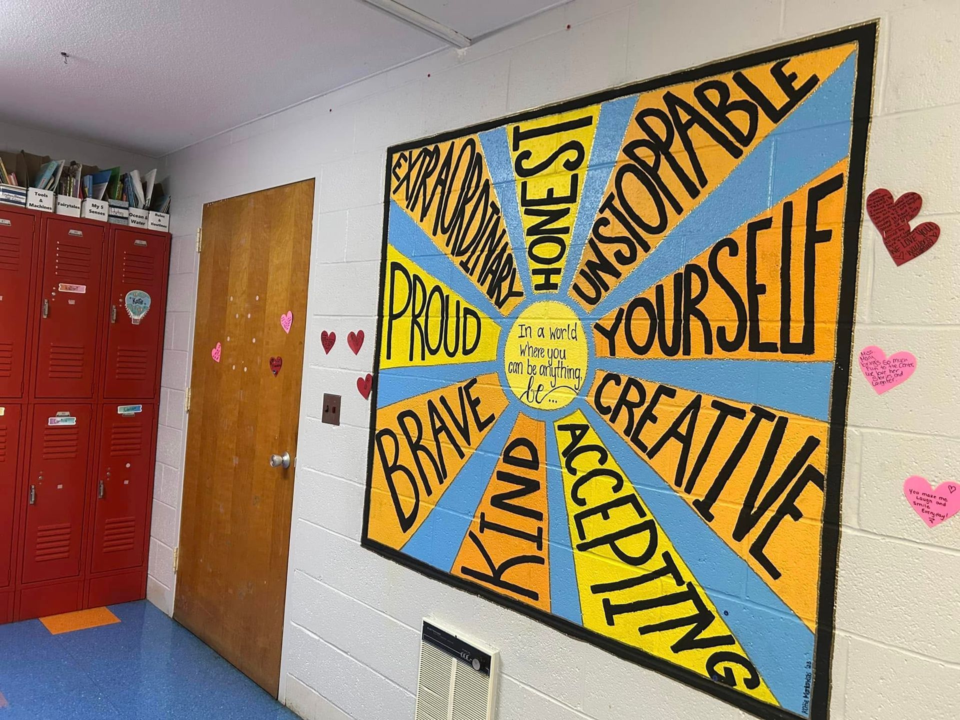 A mural on a wall that says proud on it