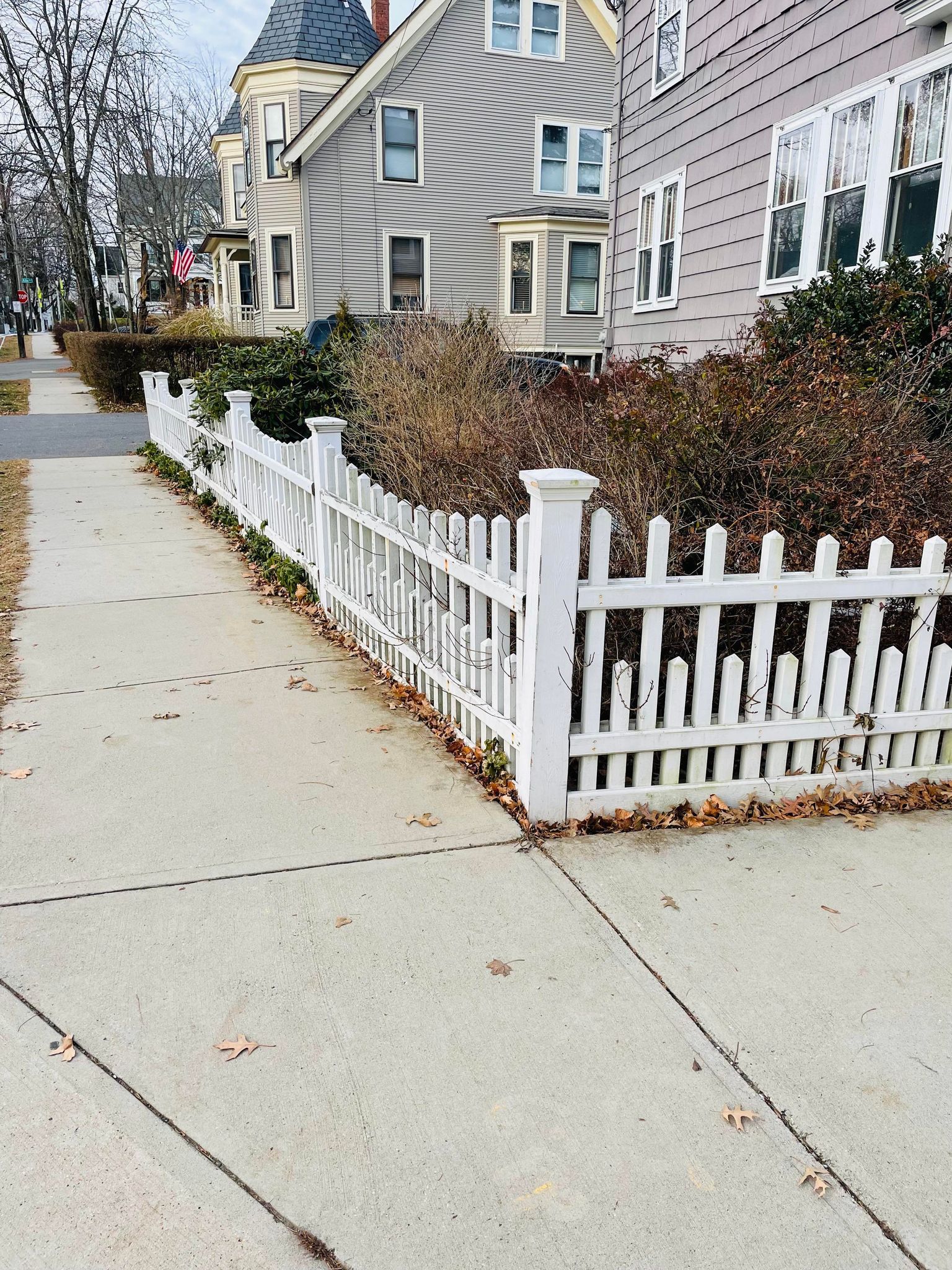 old white picket fence before removal