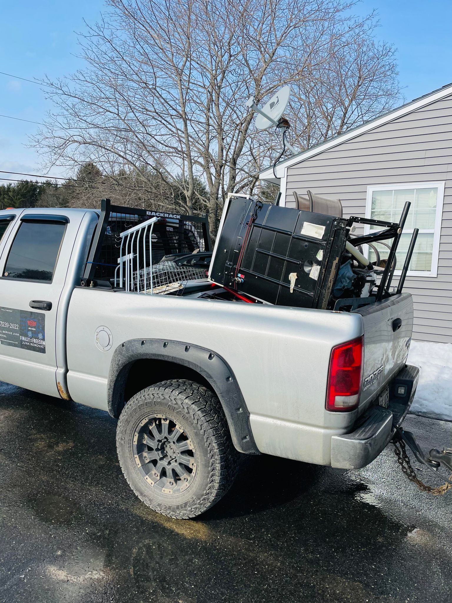 old washing machine in truck, appliance removal
