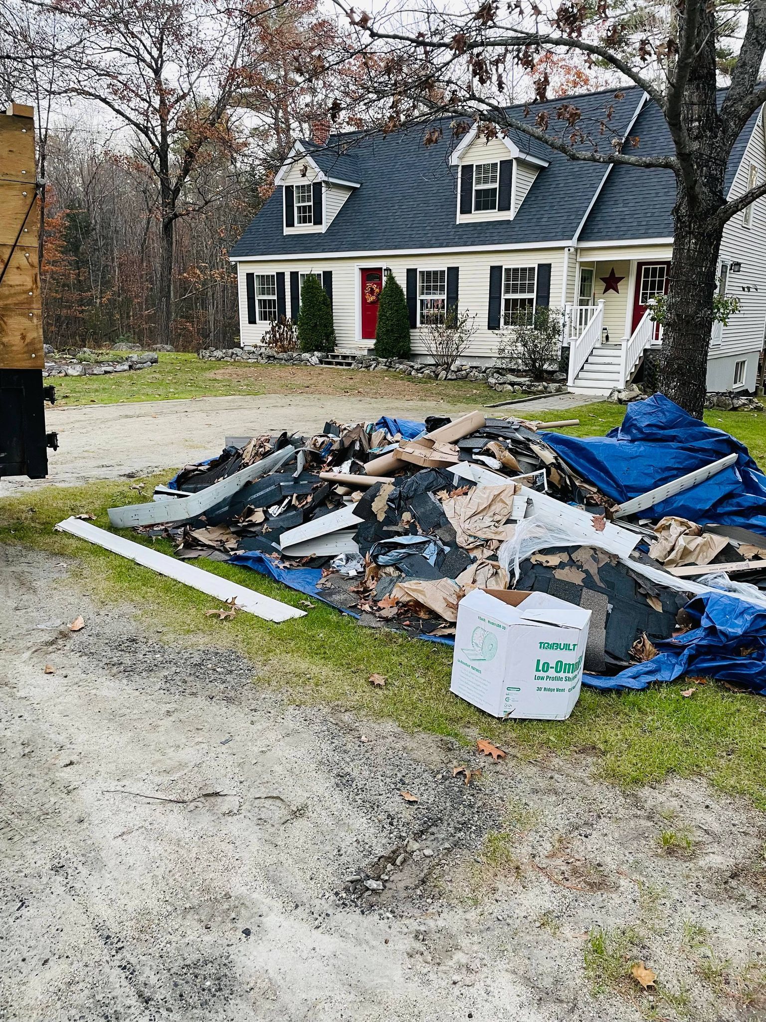 roofing waste on curb, construction debris removal