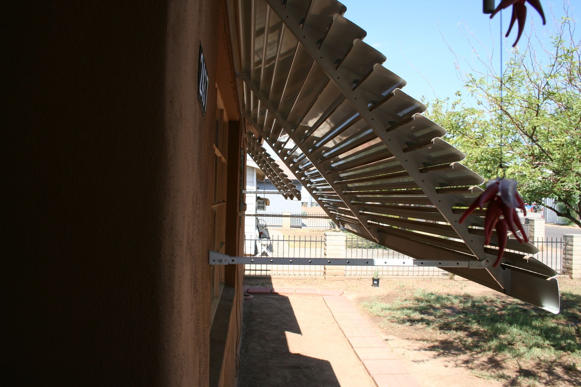 Southwest Patio's custom window awnings, enhancing curb appeal and cooling interiors in bustling Mesa.
