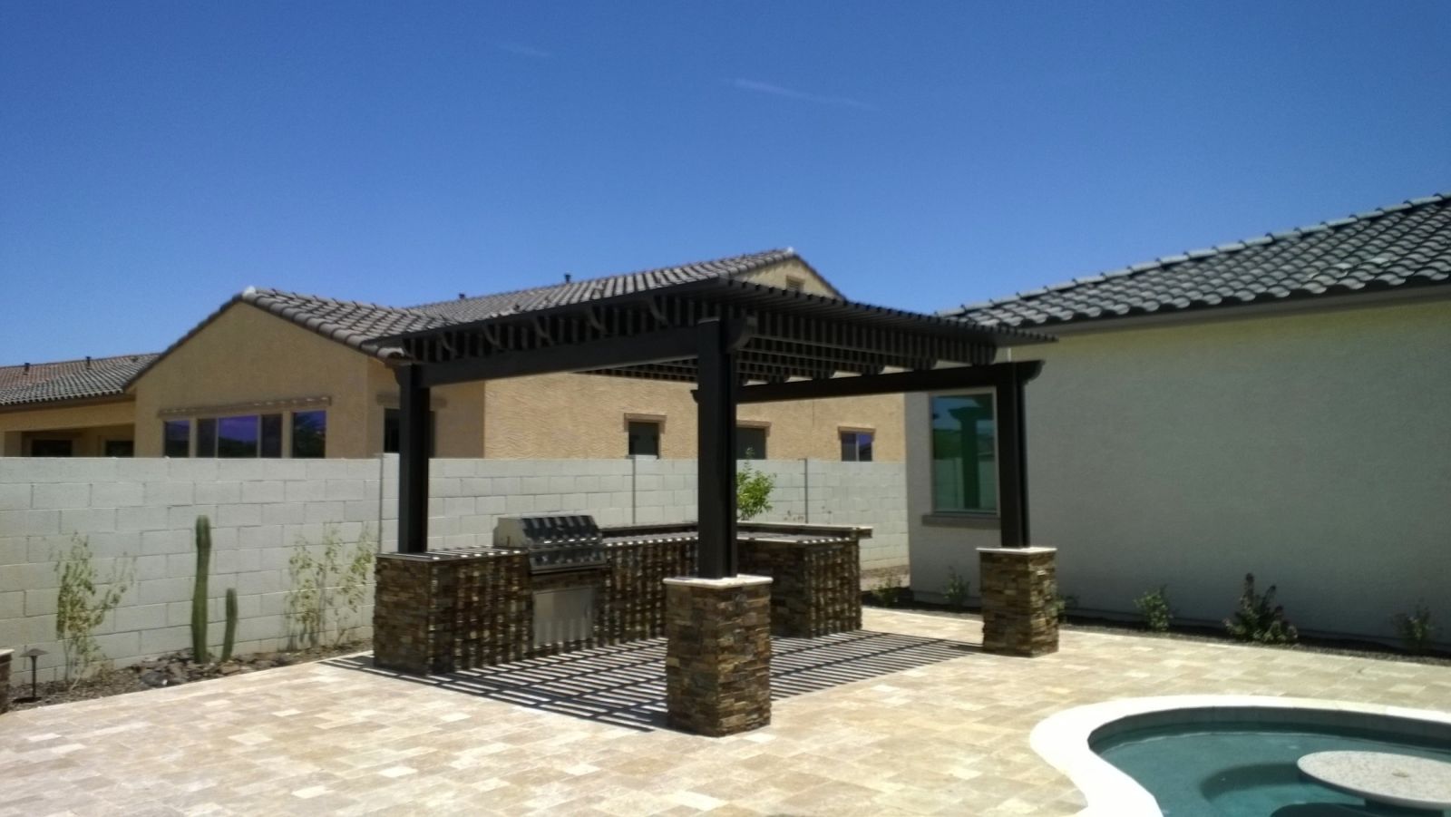 Anthem community center featuring a spacious lattice patio cover by Southwest Patio, ideal for community gatherings.