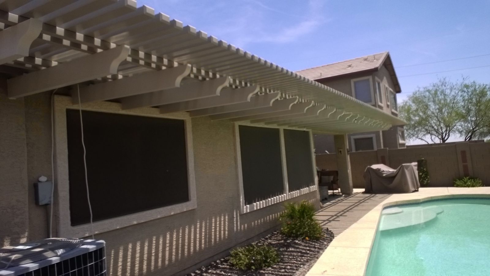 Sun Lakes home featuring a Southwest Patio lattice cover, adding sophistication to lakeside leisure.