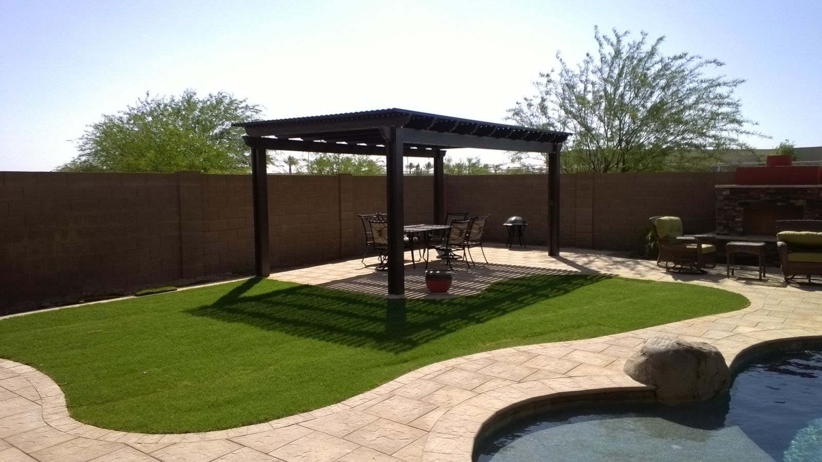 Rio Verde residence embracing the outdoors with a Southwest Patio lattice patio cover, blending luxury with nature.